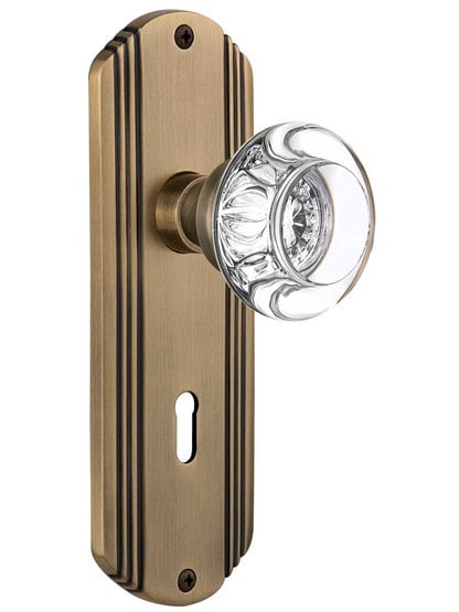 Streamline Moderne Mortise Lock Set with Round Crystal Glass Knobs with Keyhole in Antique Brass.